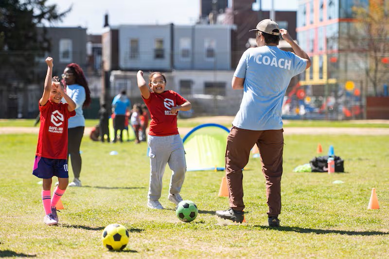 Children celebrating at a Safe-Hub Philadelphia soccer session